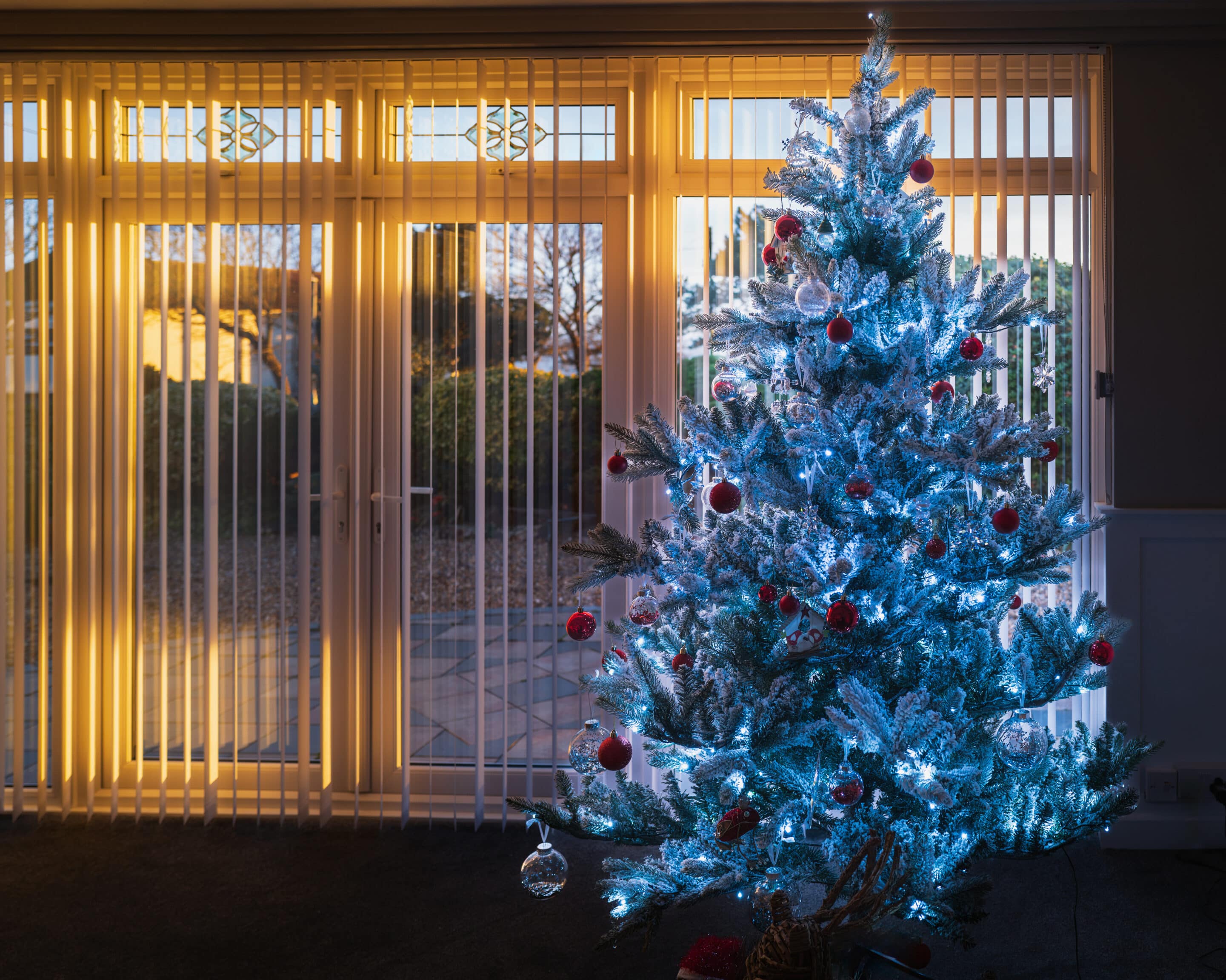 Best Blinds for a Sliding Glass Door, with beautiful Christmas tree in front of the window