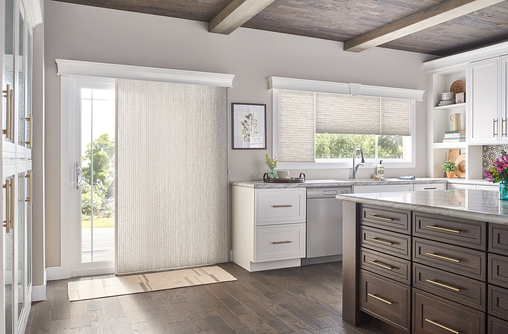 Vertical cellular shades covering a sliding glass door leading from the patio to the kitchen.